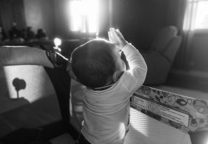 Black and White Photo of a Kid Praying